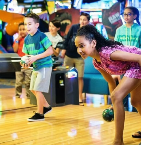 girl bowling at country junction